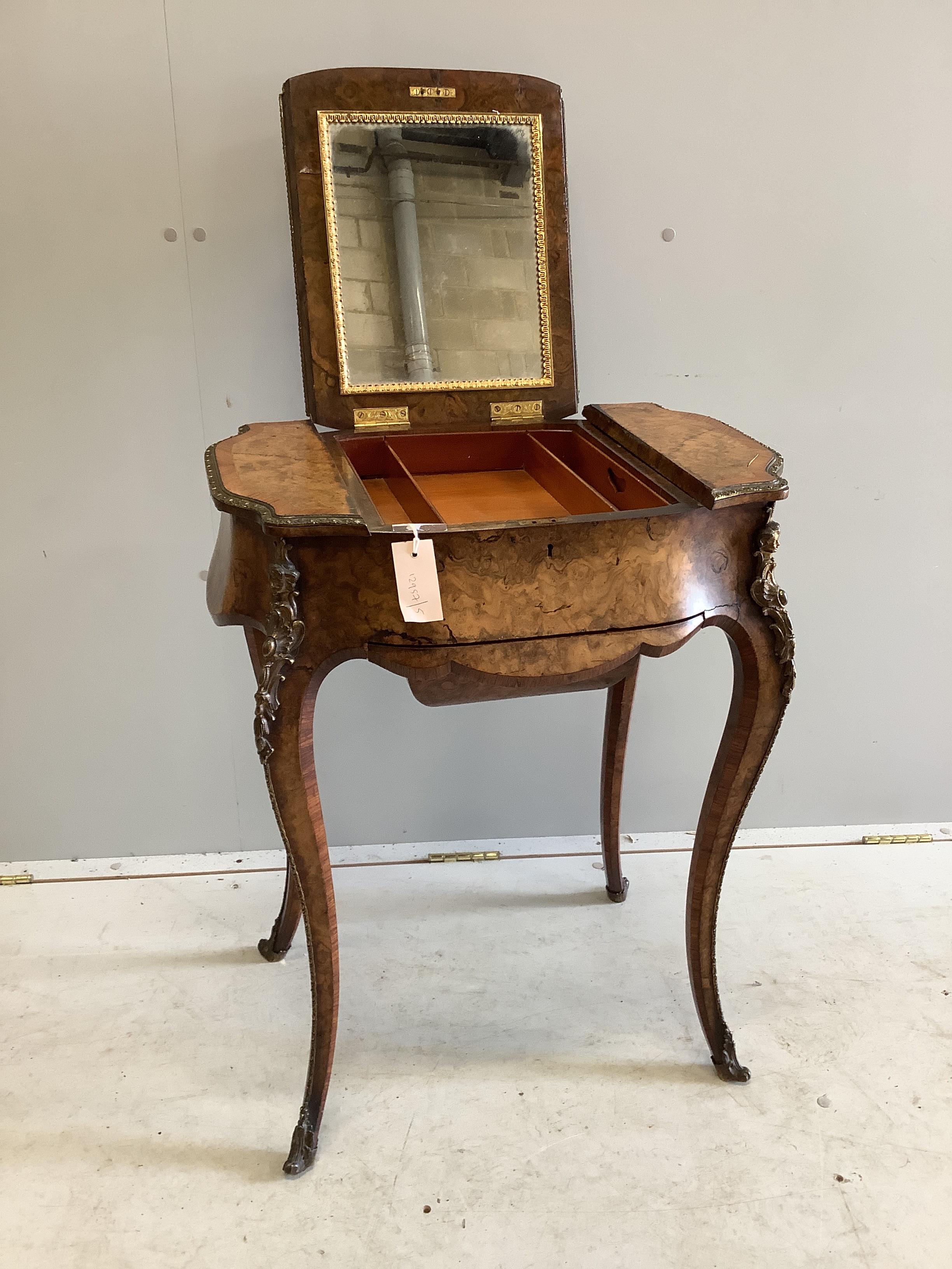 A Victorian gilt metal mounted tulip banded burr walnut enclosed dressing table/work box, width 56cm, depth 39cm, height 73cm